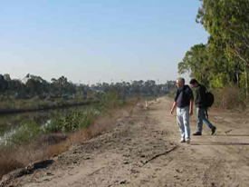 Peer walking along the road by the San Diego Creek
